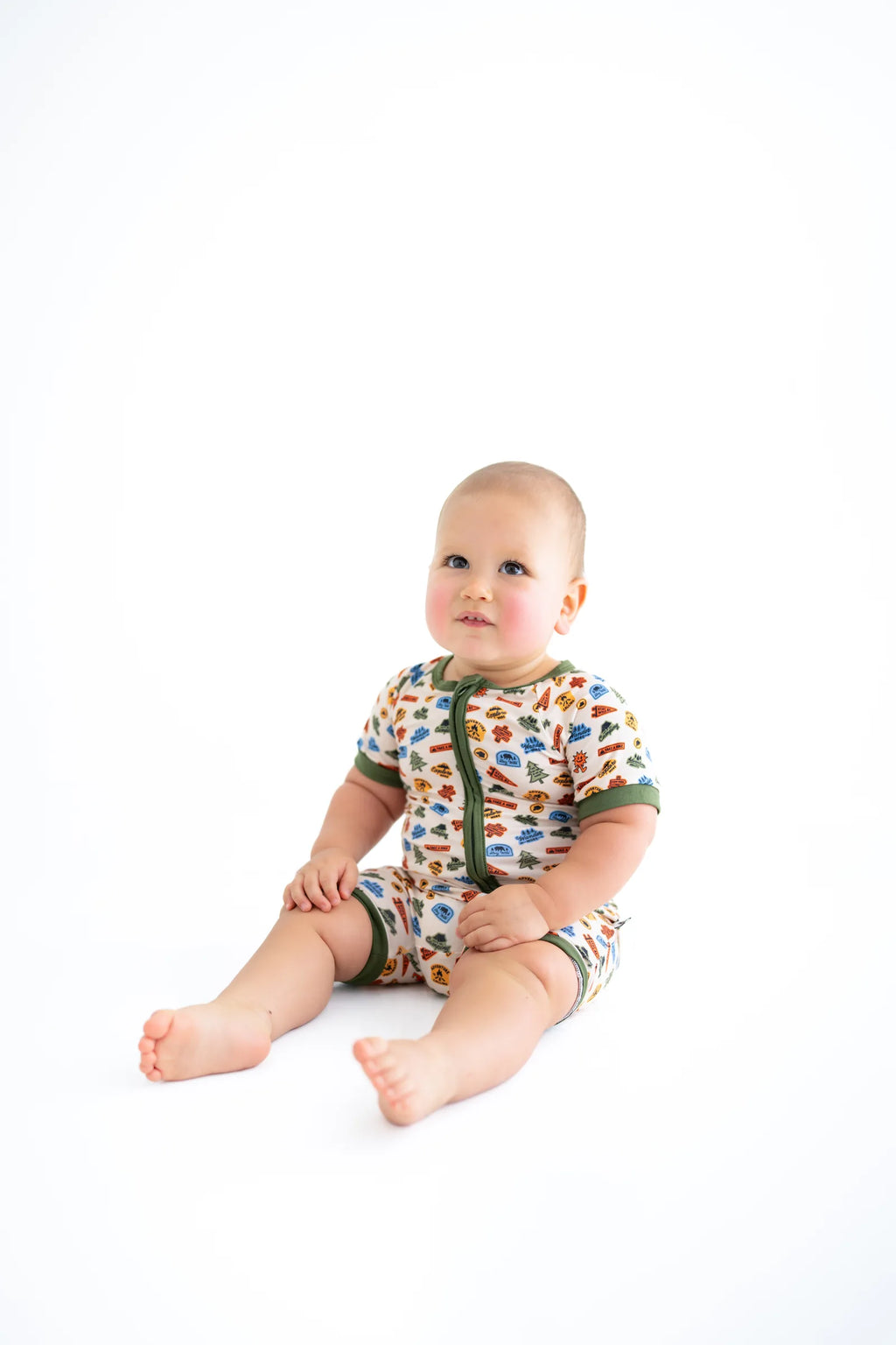 Sonny sitting in the Summer Camp Onesie