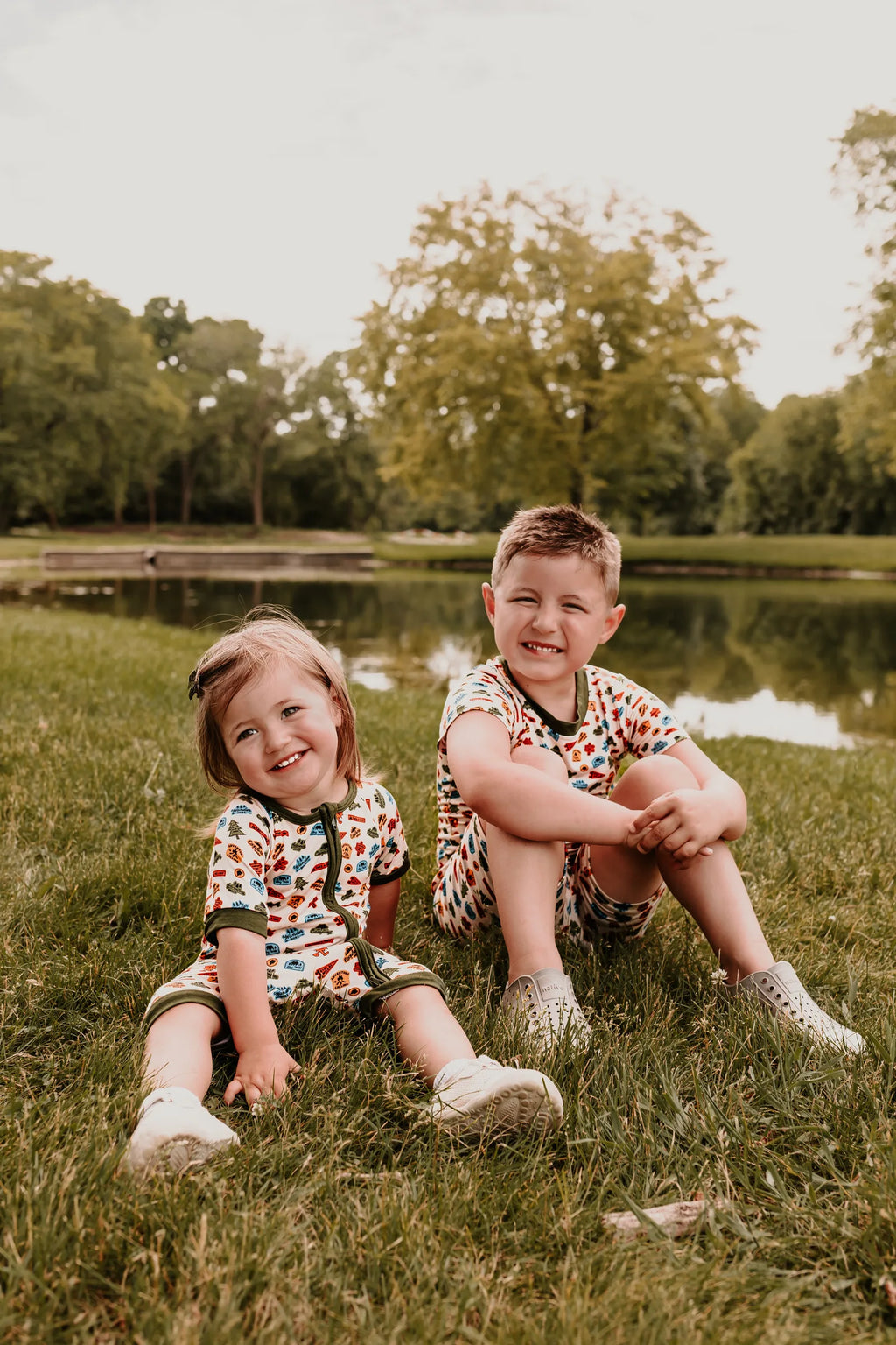 Kids wearing the Summer Camp collection by the lake